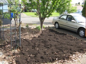 Adding soil in the flower bed